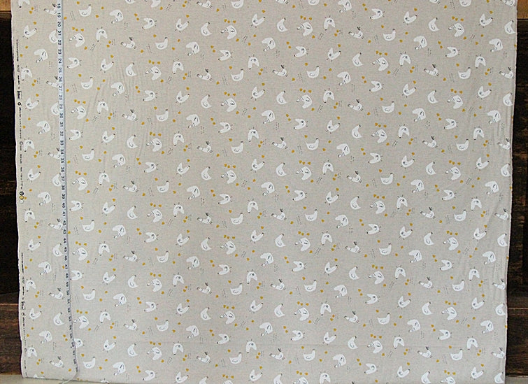 Fabric with small white duck pattern on a gray background