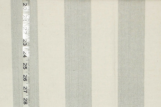 Textured fabric with horizontal stripes and a ruler for scale on a beige background