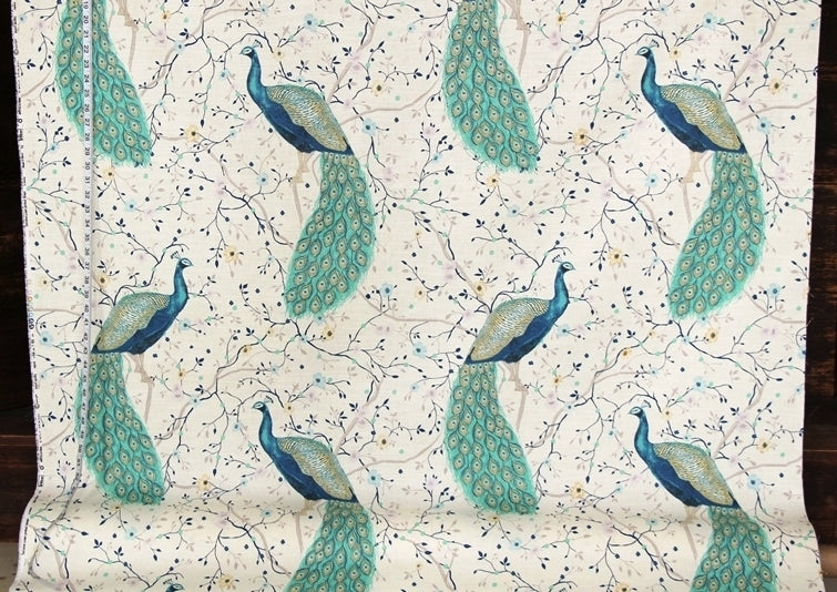 Fabric with peacock pattern on a white background