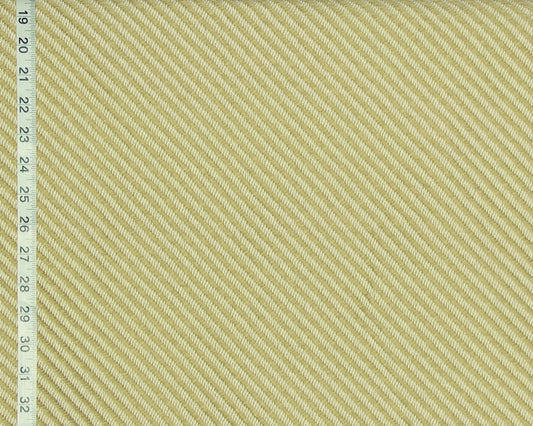 A close-up of a woven fabric texture in a pale warm yellow-beige color, with a measuring ruler visible along the left edge for scale.