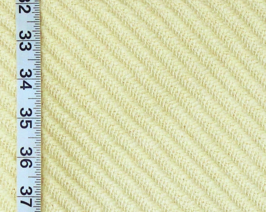 Close-up of a pale yellow ribbed fabric texture with a white measuring ruler along the left edge for scale.