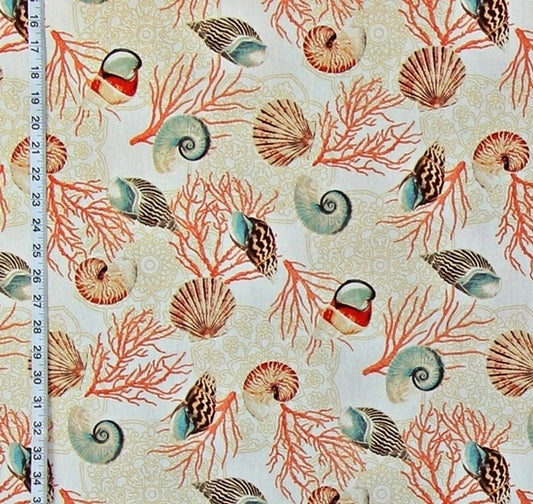Seashell and coral pattern on fabric with a ruler for scale.