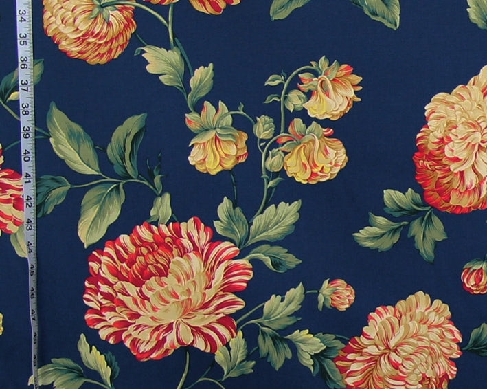Floral fabric pattern with red and yellow flowers on a blue background