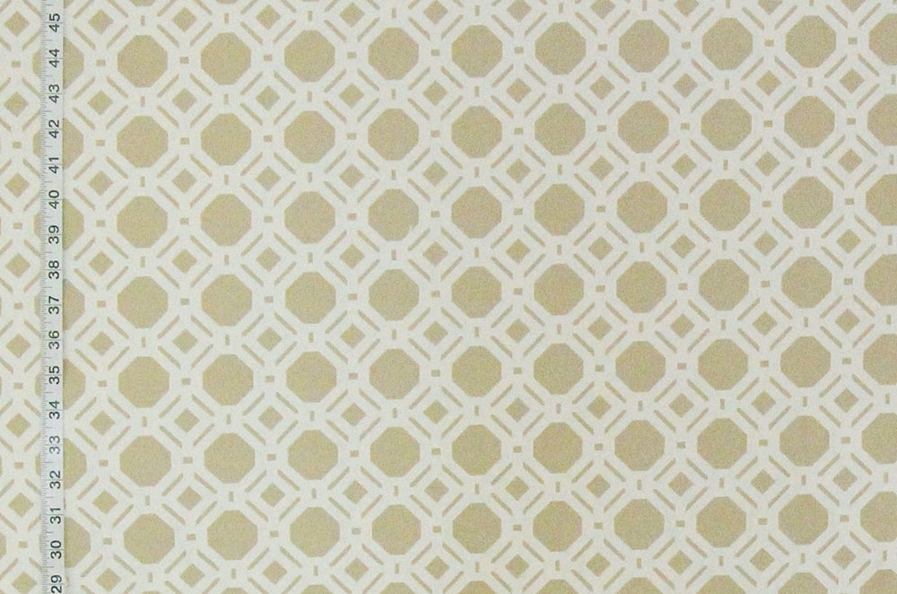 A close-up of a repeating geometric pattern featuring light beige circles and diamonds on an off-white background, with a vertical ruler scale visible along the left edge.