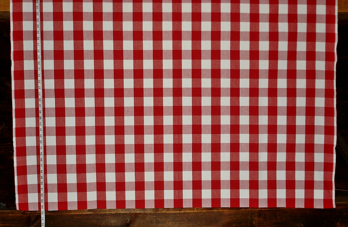 Red and white checkered fabric on a wooden surface