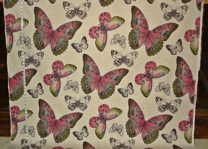 Fabric with a pattern of pink and green butterflies on a beige background
