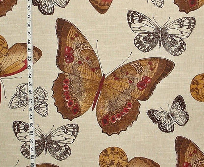 Butterfly pattern fabric with a ruler for scale on a beige background