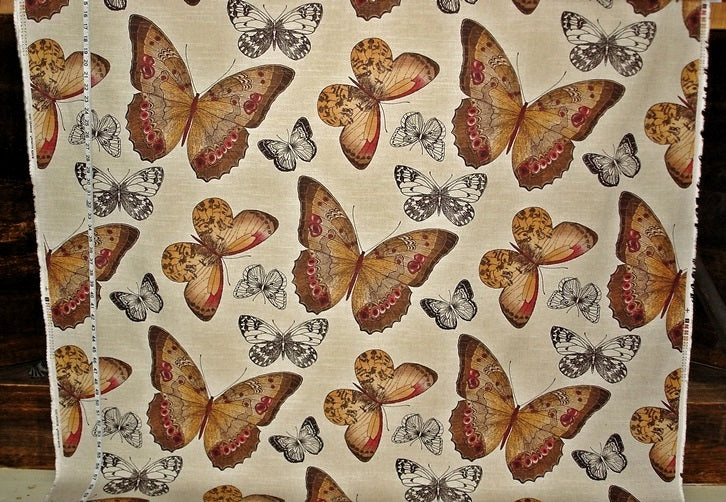 Fabric with a pattern of butterflies on a beige background