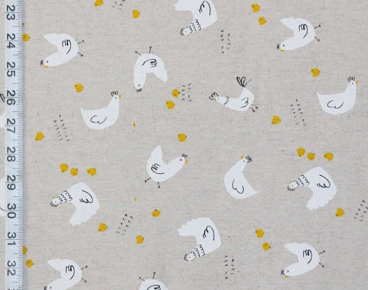 Fabric with chicken pattern and ruler on the side