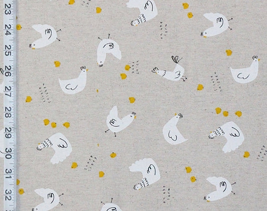 Fabric with chicken pattern and ruler on the side