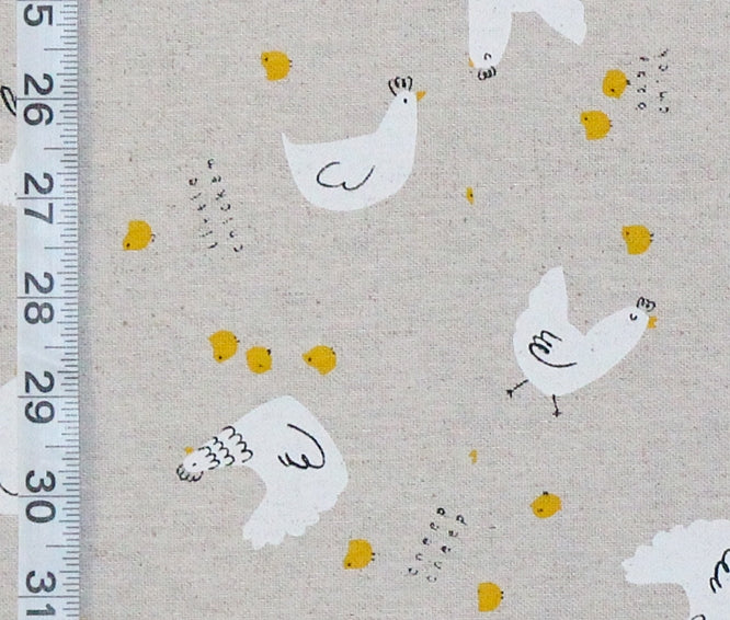 Pattern of white chickens and yellow chicks on a beige background with a ruler for scale.