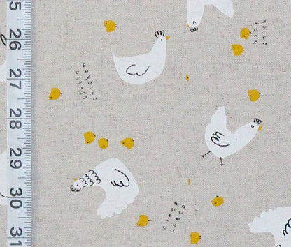 Pattern of white chickens and yellow chicks on a beige background with a ruler for scale.