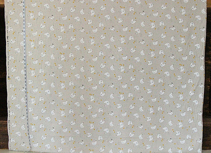 Fabric with small white duck pattern on a gray background