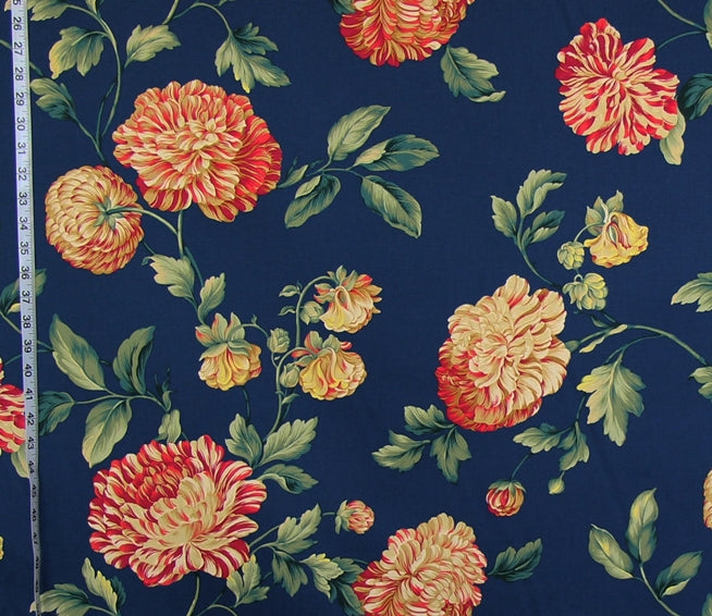 Floral fabric pattern with red and yellow flowers on a blue background