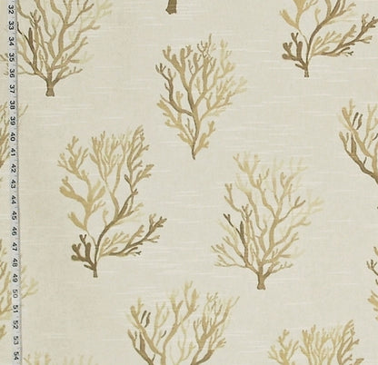 Fabric with beige coral pattern and a ruler for scale on a light background