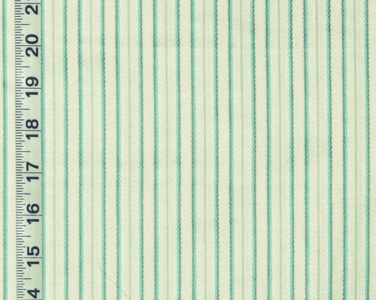 A close-up of striped fabric with alternating mint green and off-white vertical stripes, shown next to a black inch ruler for scale.