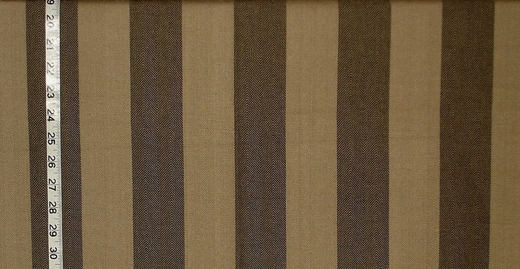 Striped fabric with brown and beige stripes and a ruler for scale.