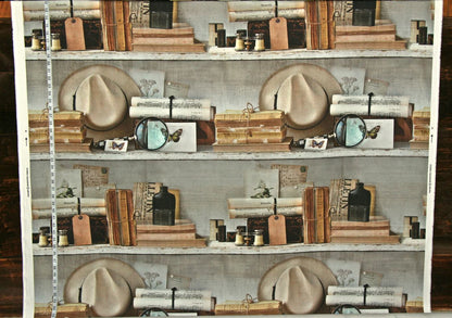 A repeating pattern of vintage bookshelves filled with books, hats, bottles, and small accessories, shown as a fabric or wallpaper design with a measuring tape along the left edge.