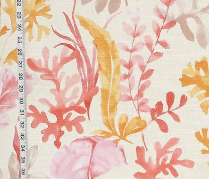 Floral patterned fabric with a ruler for scale on a white background