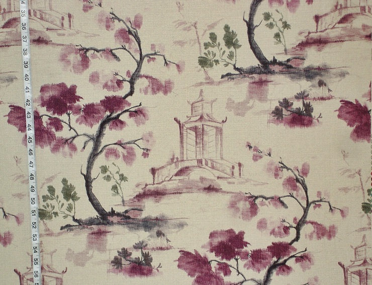 Fabric with cherry blossom and pagoda design, measured against a ruler.