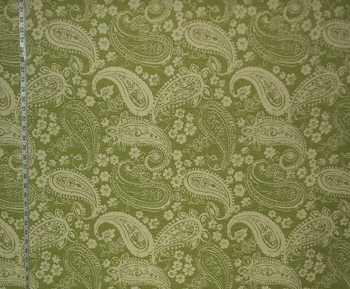 Fabric with paisley pattern on a green background