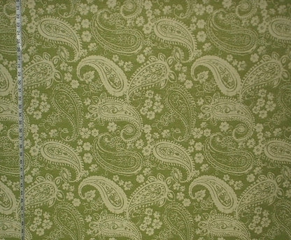 Fabric with paisley pattern on a green background