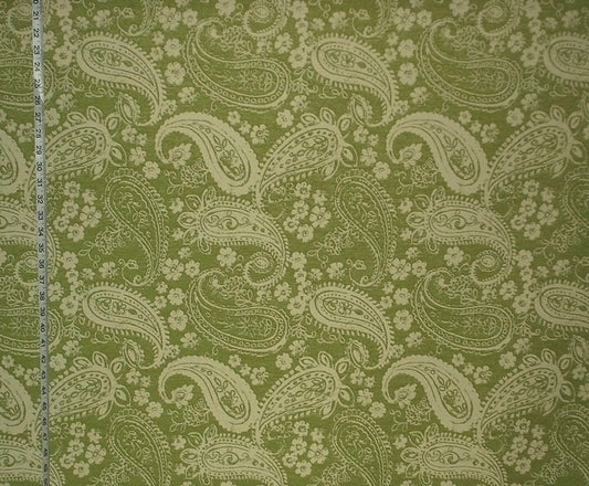 Fabric with paisley pattern on a green background