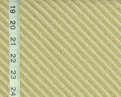 A close-up of a woven fabric texture in pale yellow and off-white, with a white measuring tape running vertically along the left edge for scale.