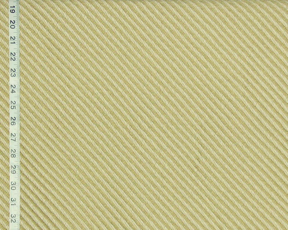 A close-up of a woven fabric texture in a pale warm yellow-beige color, with a measuring ruler visible along the left edge for scale.