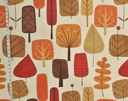 Fabric with autumn-themed tree pattern on a beige background