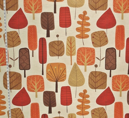 Fabric with a pattern of stylized trees in red, brown, and orange on a beige background.