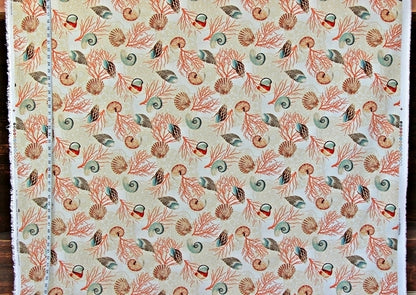 Patterned fabric with sea-themed design on a beige background