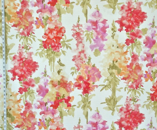 Floral fabric pattern with a ruler for scale on a light background