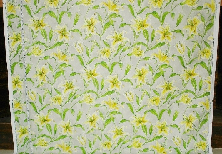 Floral pattern with yellow flowers and green leaves on a light background