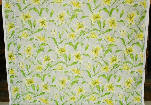 Floral pattern with yellow flowers and green leaves on a light background