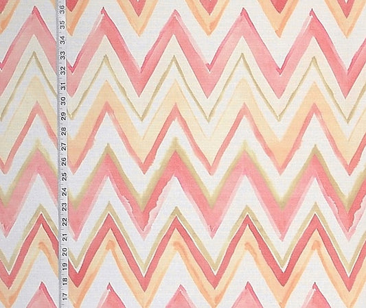 Fabric with pink and beige zigzag pattern and a ruler for scale.