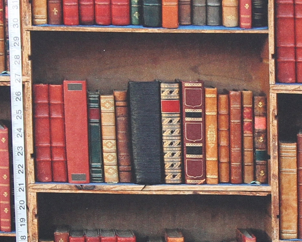 A close-up view of vintage bookshelves filled with antique leather-bound books. A white measuring tape is visible along the left edge, likely indicating shelf or book dimensions.