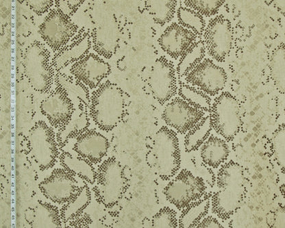 Beige and brown snakeskin pattern fabric with a scale design, shown with a measurement ruler on the left edge.